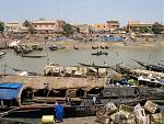 The river town of Mopti and the traditional, lean-hulled river boat called a pinasse